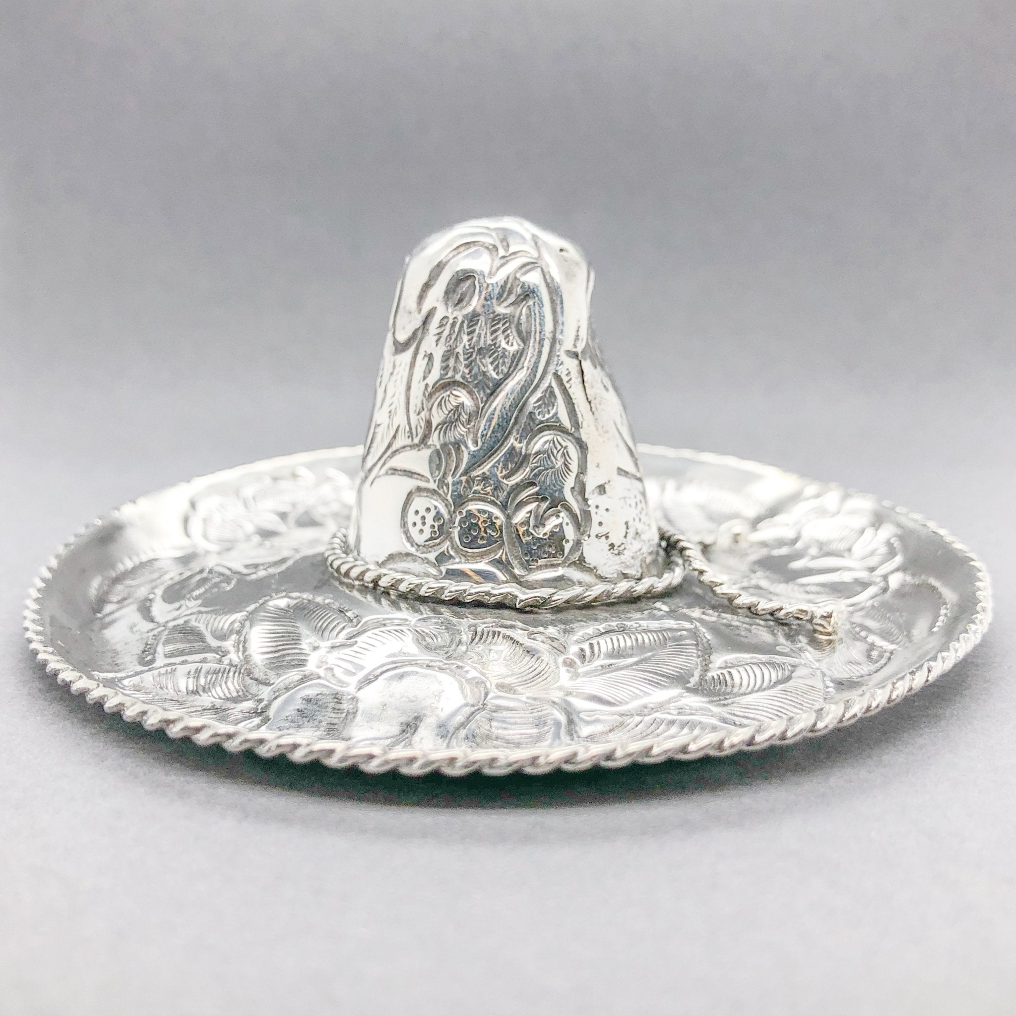 http://walterbaumanjewelers.com/cdn/shop/products/estate-sterling-silver-mexican-sombrero-trinket-dish-851922.jpg?v=1622261288