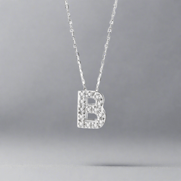 14K W Gold small 0.02ctw H/I1-SI2 diamond initial 'B' pendant - Walter Bauman Jewelers
