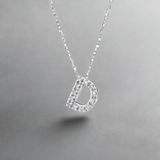 14K W Gold small 0.02ctw H/I1-SI2 diamond initial 'D' pendant - Walter Bauman Jewelers