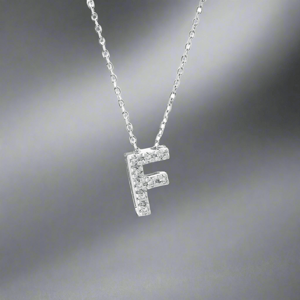 14K W Gold small 0.02ctw H/I1 - SI2 diamond initial 'F' pendant - Walter Bauman Jewelers