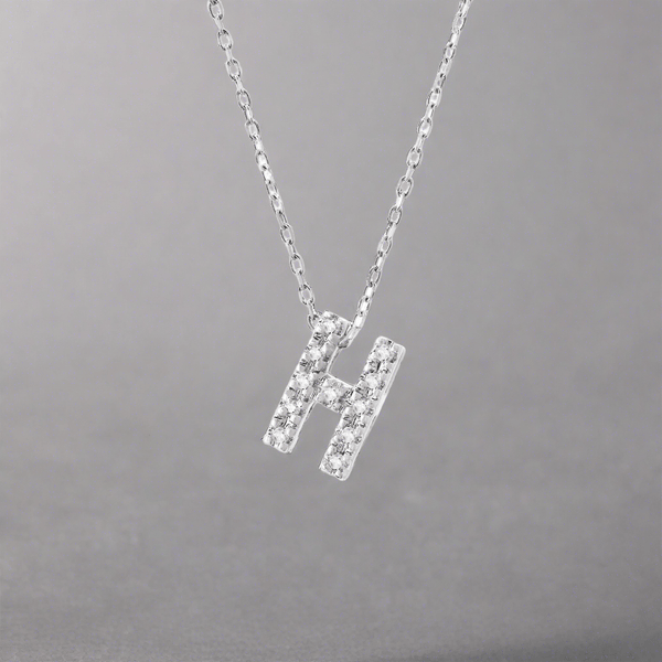 14K W Gold small 0.02ctw H/I1-SI2 diamond initial 'H' pendant - Walter Bauman Jewelers