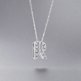 14K W Gold small 0.02ctw H/I1-SI2 diamond initial 'R' pendant - Walter Bauman Jewelers