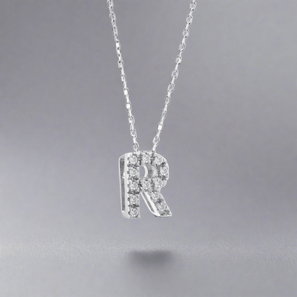 14K W Gold small 0.02ctw H/I1-SI2 diamond initial 'R' pendant - Walter Bauman Jewelers