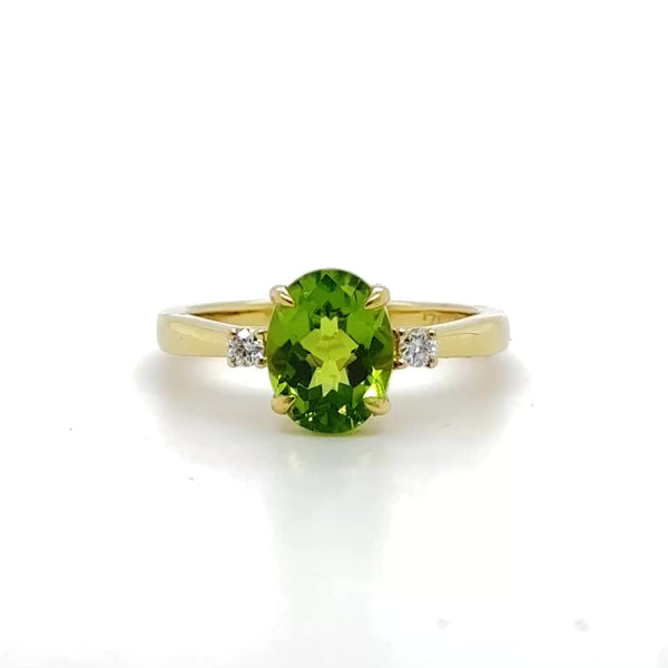 14K Y Gold 0.09ctw Diamond and 2.10ct Oval Peridot Ring