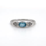 14K W Gold 0.05ctw Diamond 0.50ct Oval Blue Topaz Ring