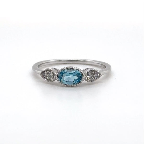 14K W Gold 0.05ctw Diamond 0.50ct Oval Blue Topaz Ring