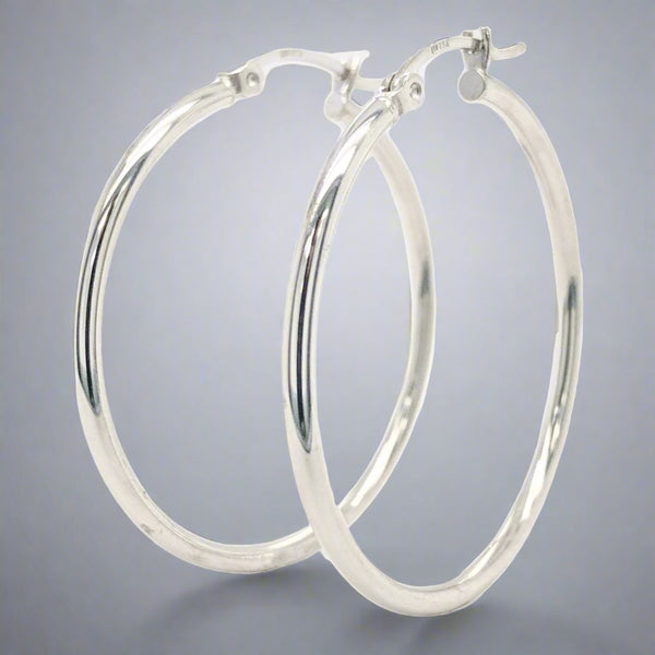 14K WG 2mm x 35mm Medium Hoop Earrings - Walter Bauman Jewelers