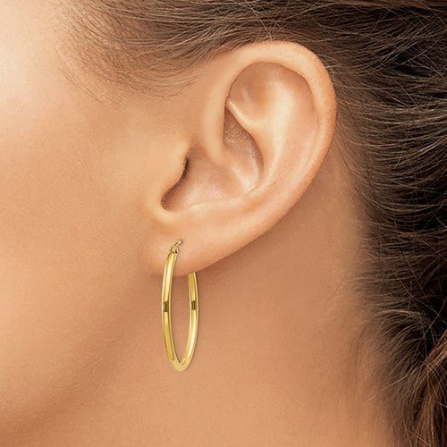 14K Y Gold Oval Hoop Earrings - Walter Bauman Jewelers