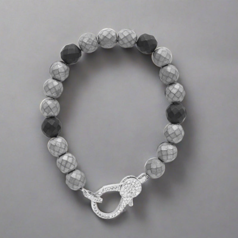 Faceted Grey and Black Hematite Bead Stretch Bracelet with CZ Rhodium Lobster Clasp. - Walter Bauman Jewelers
