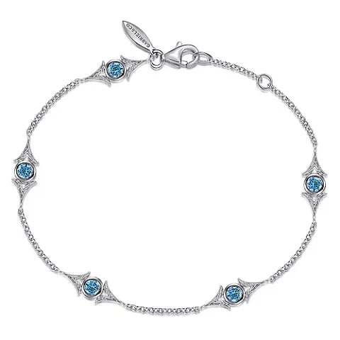 SS 7" 0.66ctw Blue Topaz Station Bracelet - Walter Bauman Jewelers